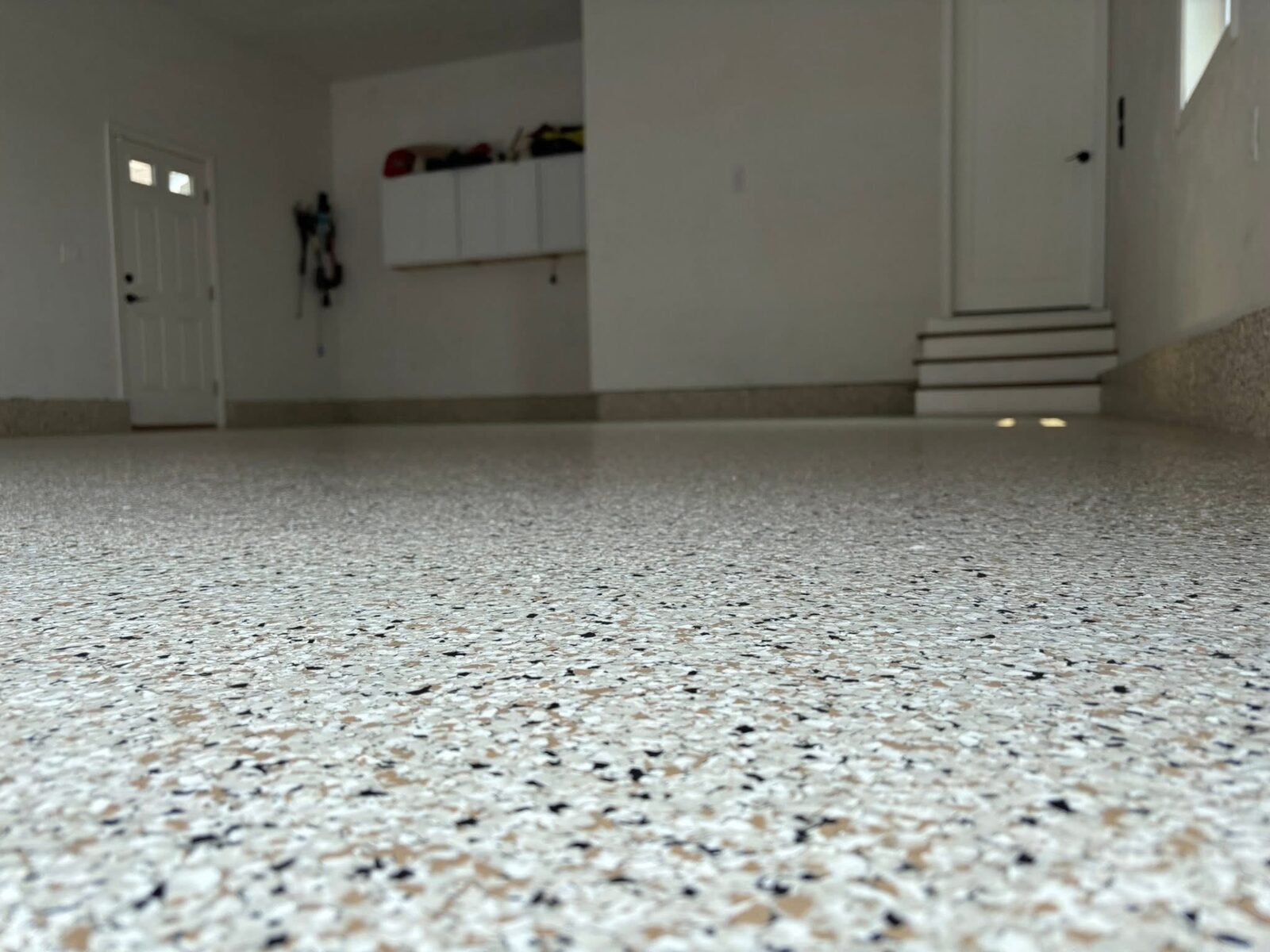 Epoxy Bros tan and black flake garage floor